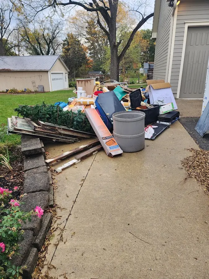 Dumpster being loaded with debris for Residential Dumpster Rental in Beaumont